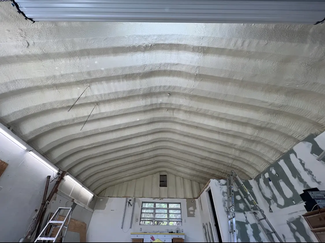 Spray polyurethane foam applied to the underside of a metal roof deck in West Loch Estate